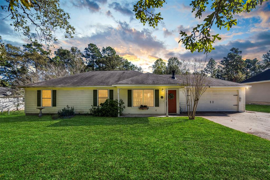 front view of a house with a yard