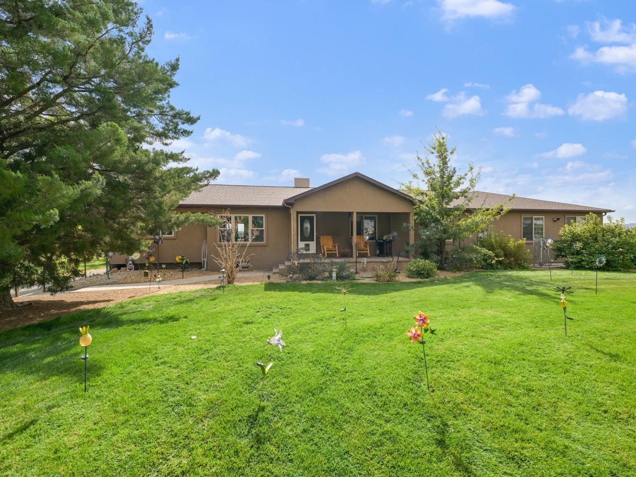 a front view of a house with garden