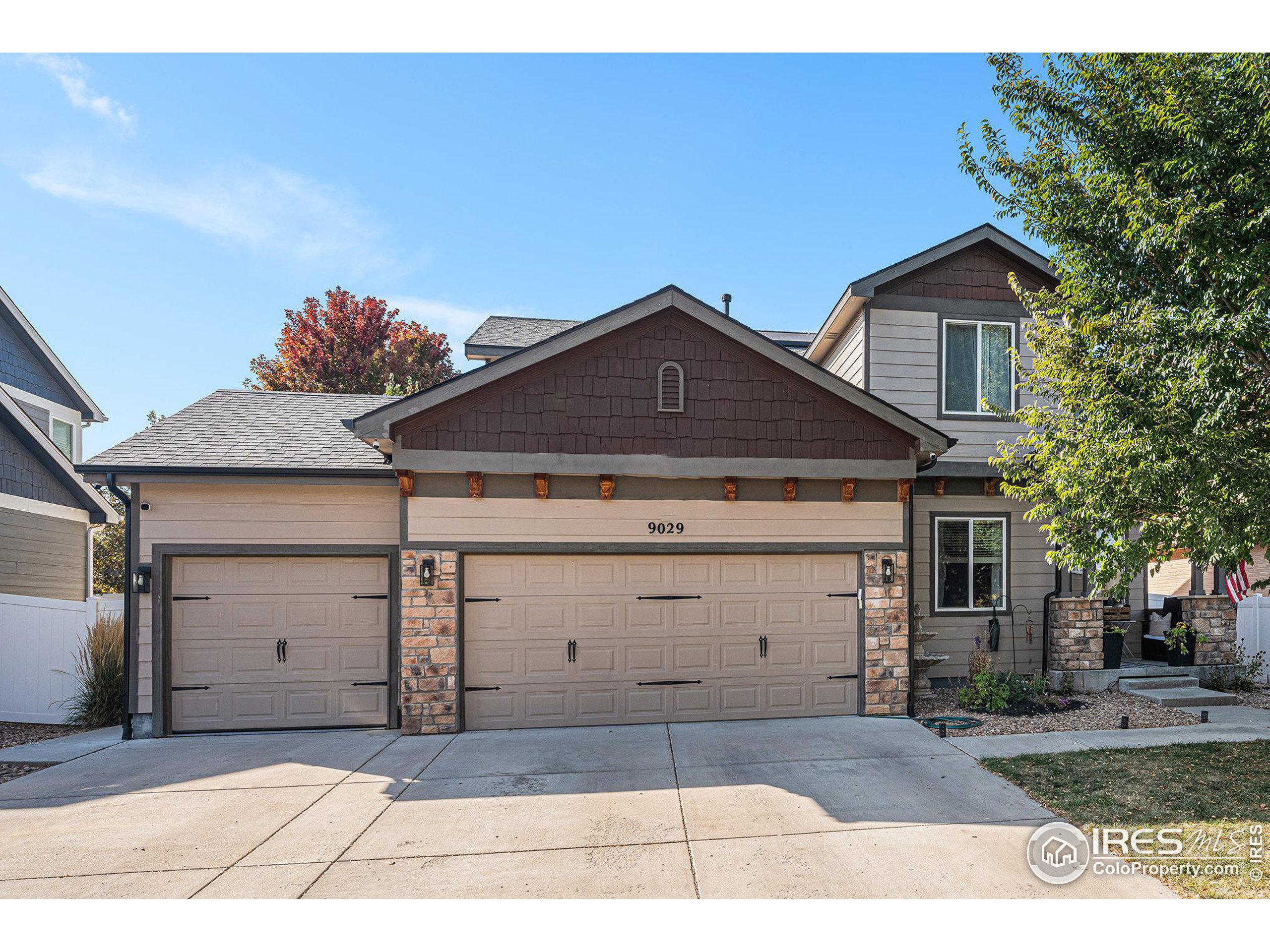 a front view of a house with a garage