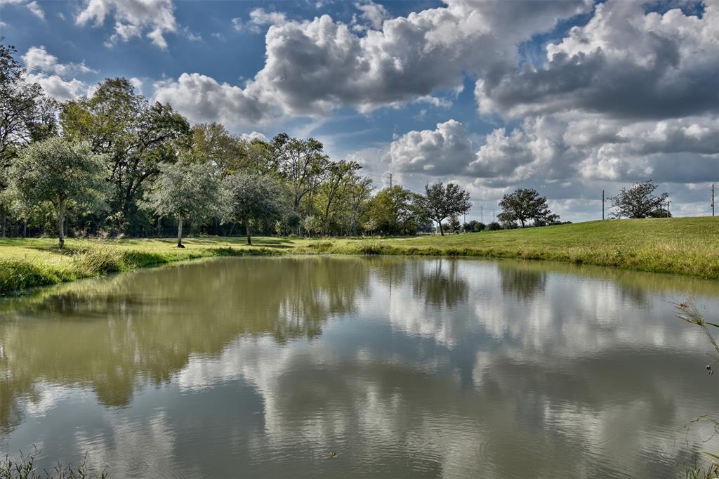 a view of a lake with a yard