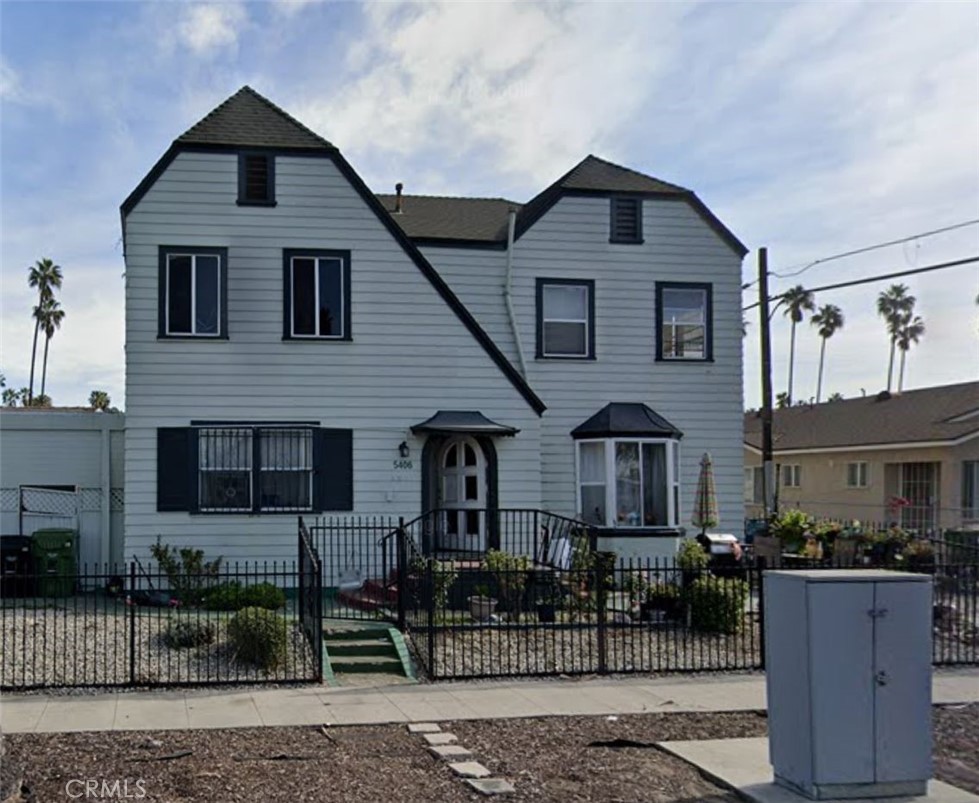 a front view of a house with garage