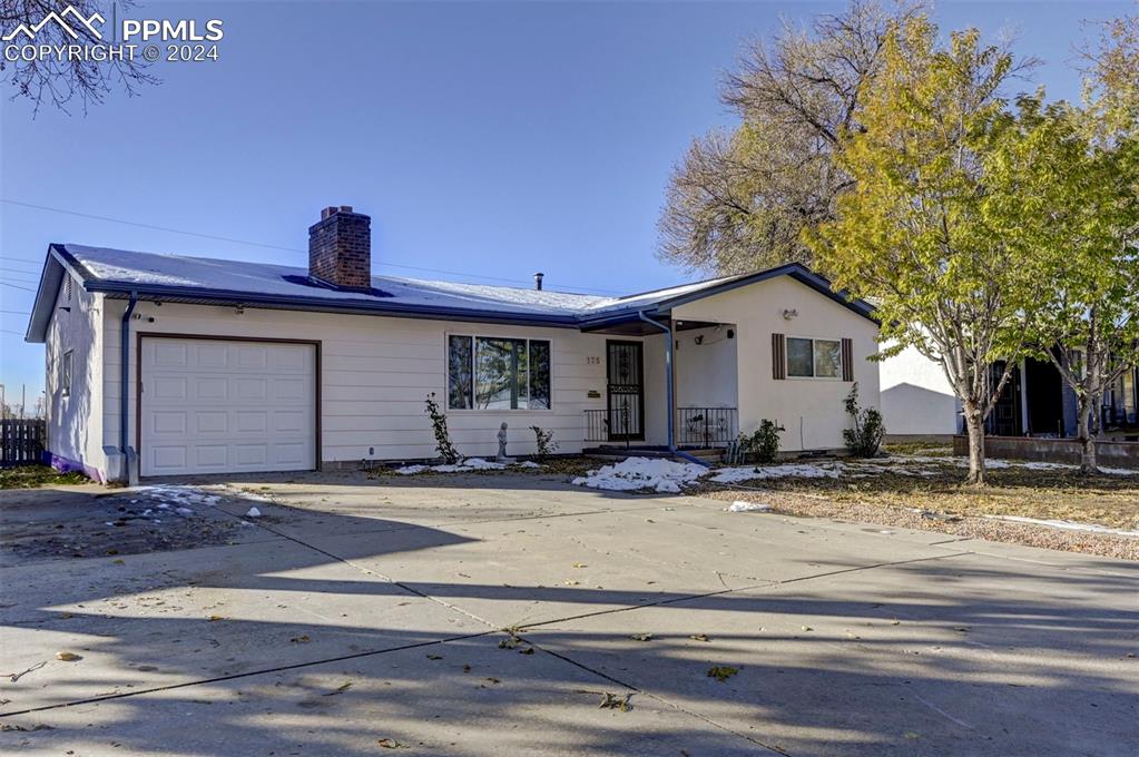 View of front of home featuring a garage