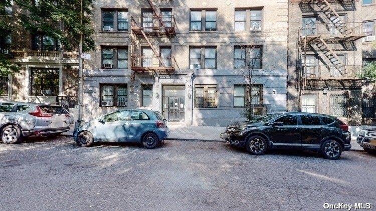 a car parked in front of a buildings