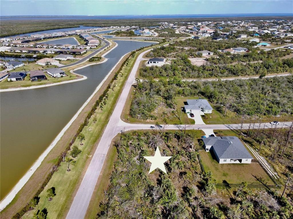 an aerial view of a residential houses with outdoor space