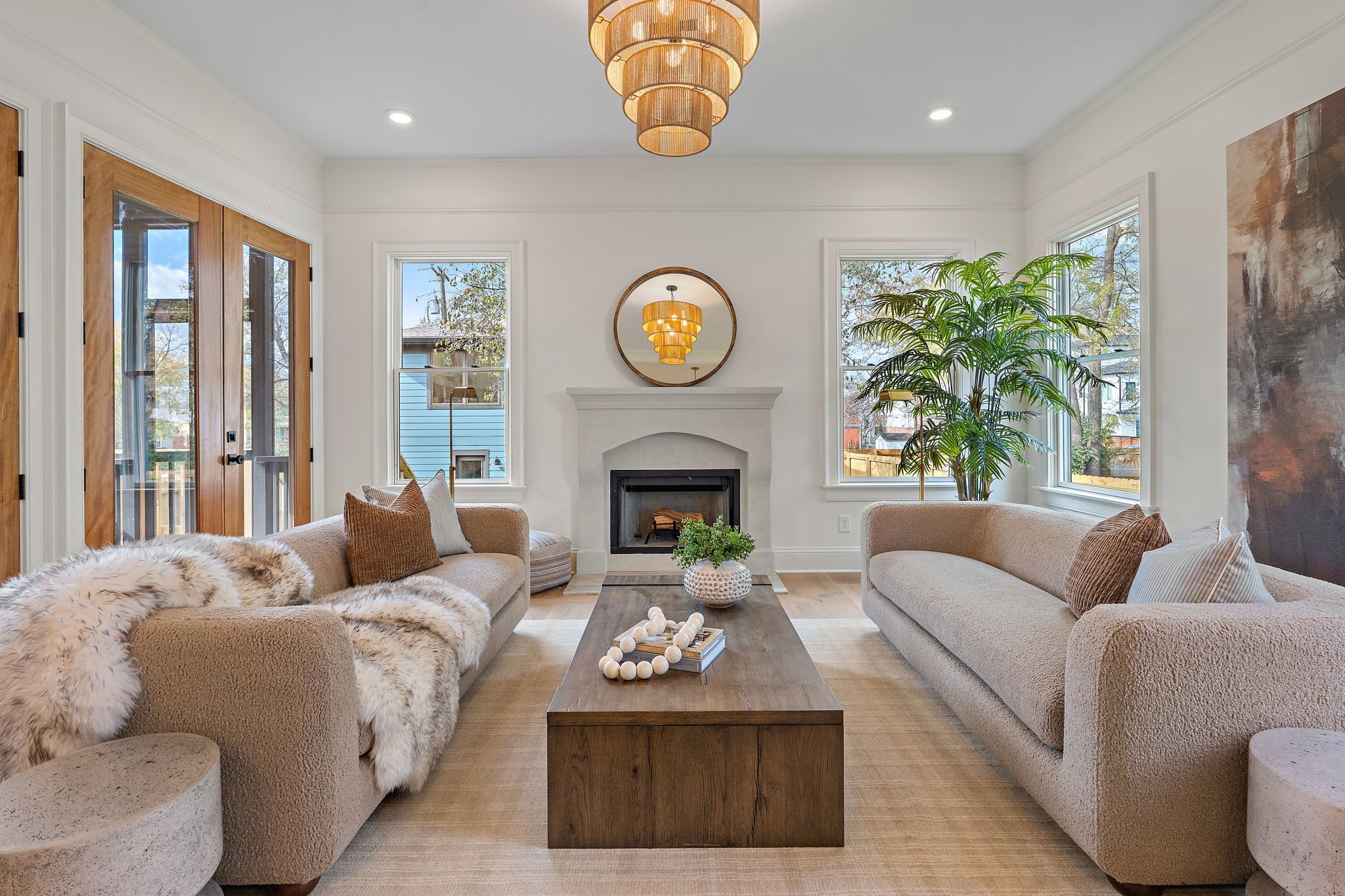 a living room with furniture a window and a fireplace