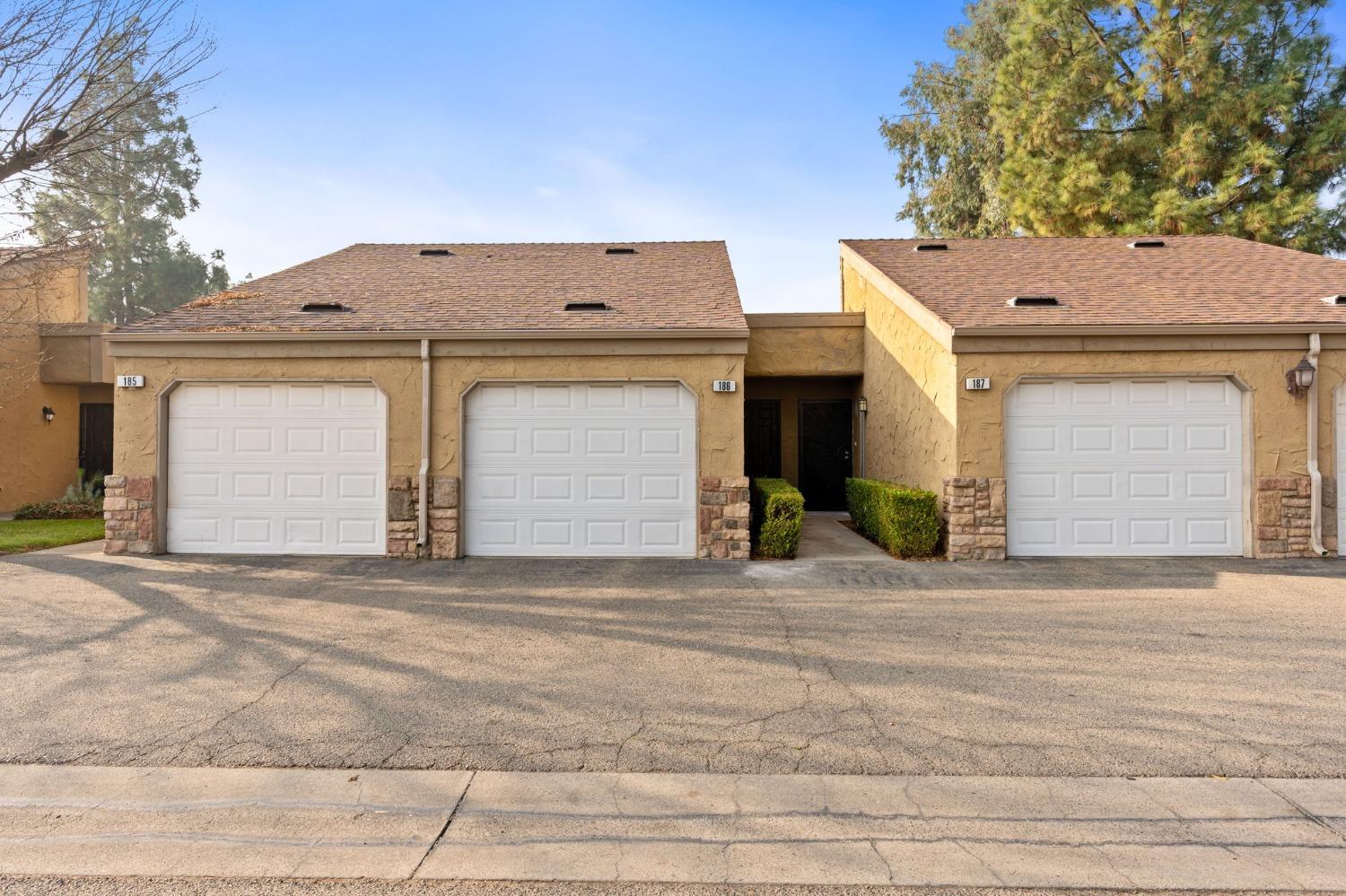 a front view of a house with a garage