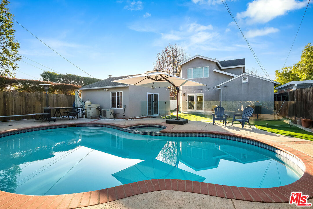 a view of a house with swimming pool