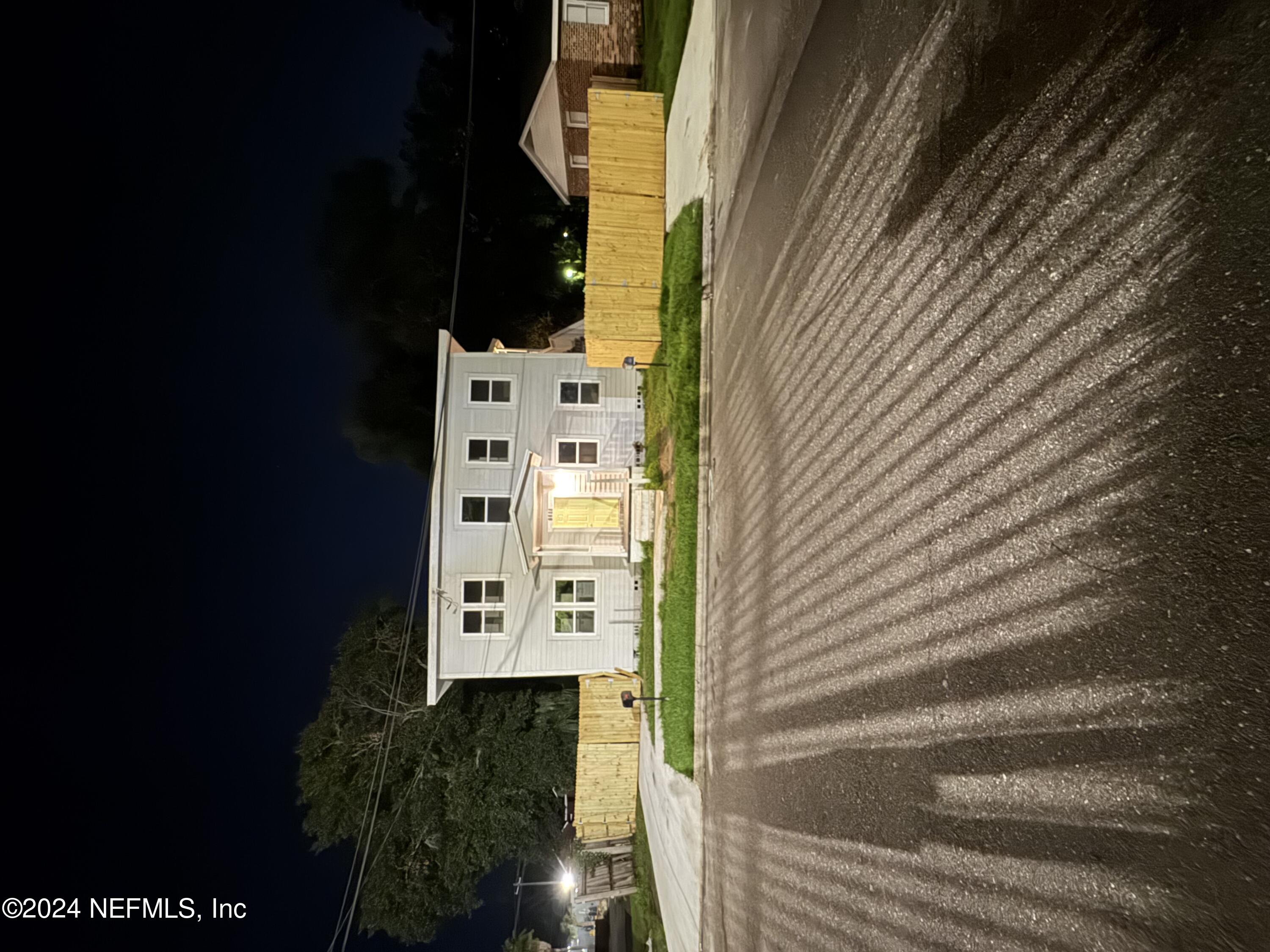 a view of swimming pool with outdoor seating and yard