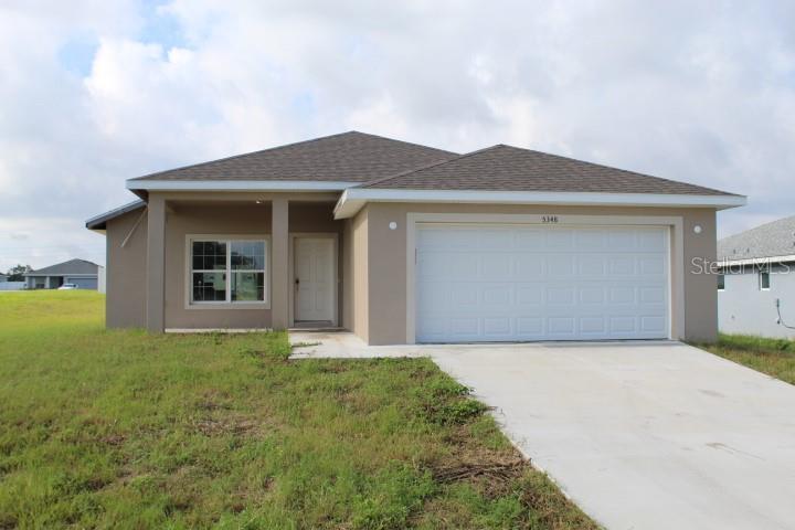 a front view of house with yard