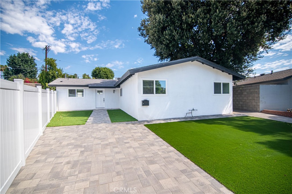 a view of a backyard of the house