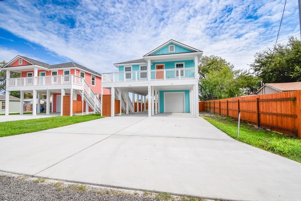 a view of multiple houses with a yard