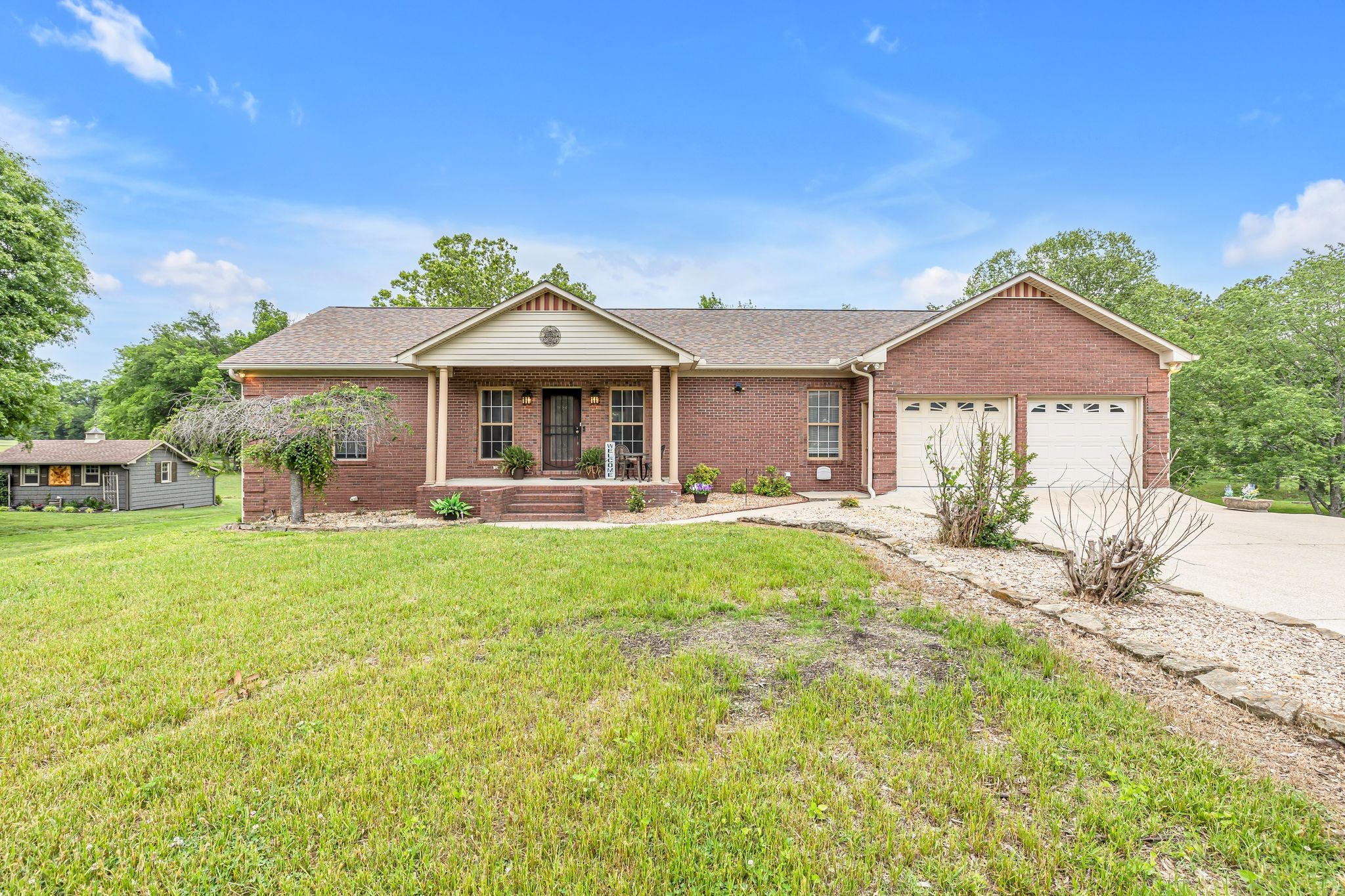 a front view of a house with a yard