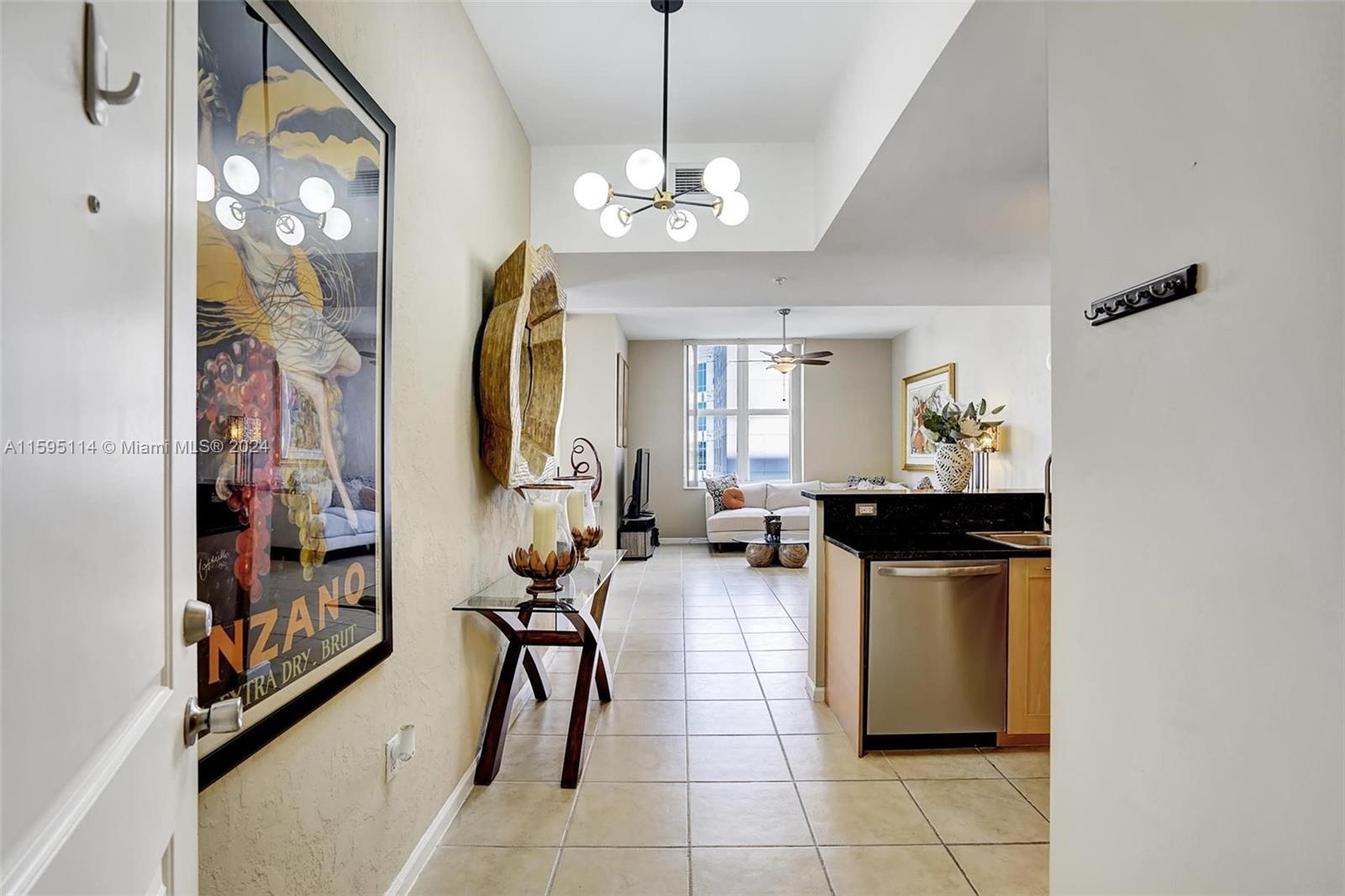 a view of a livingroom with furniture and a chandelier