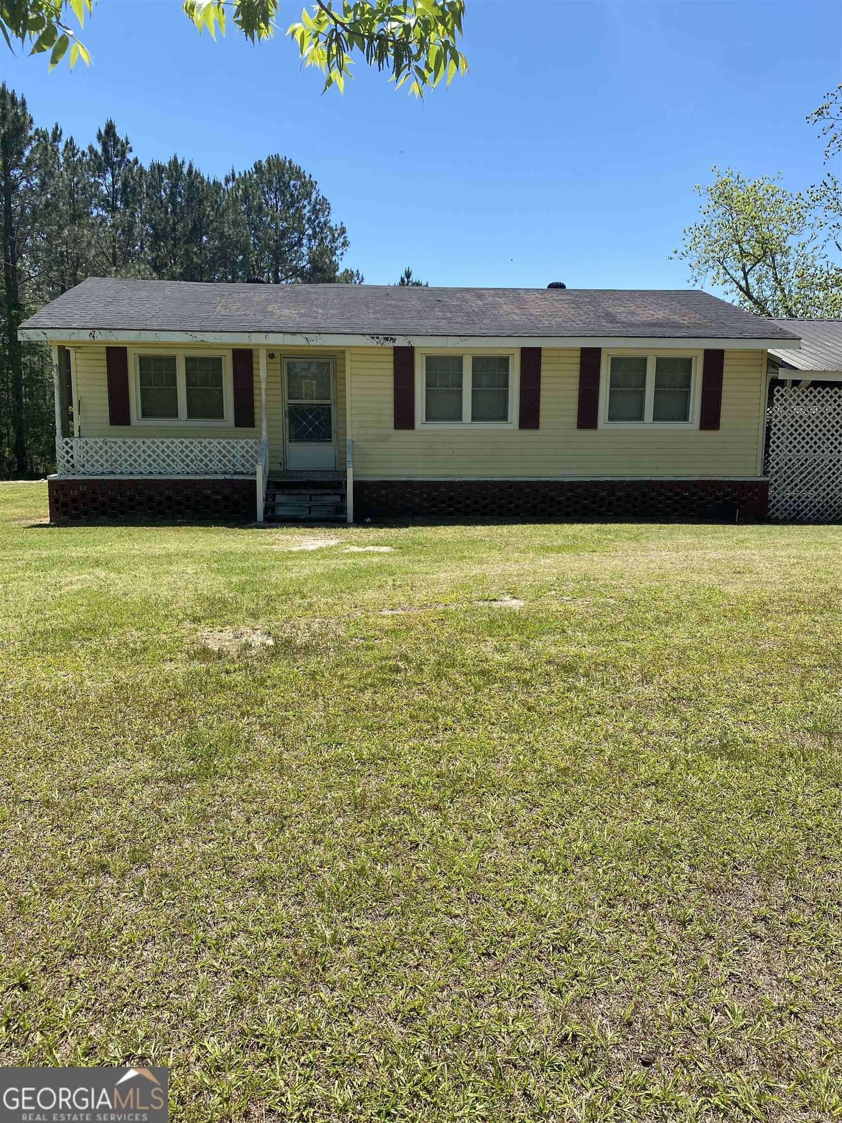 a view of a house with a garden