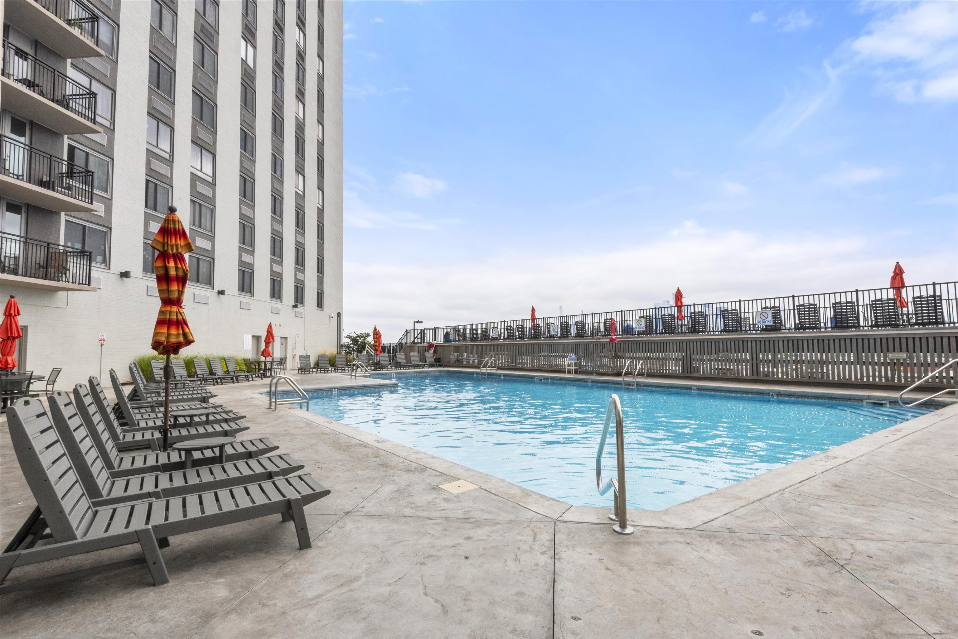 a view of a swimming pool with a lounge chair