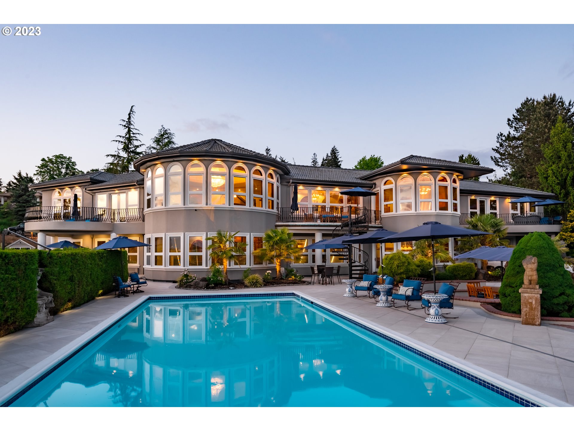 a view of swimming pool with outdoor seating