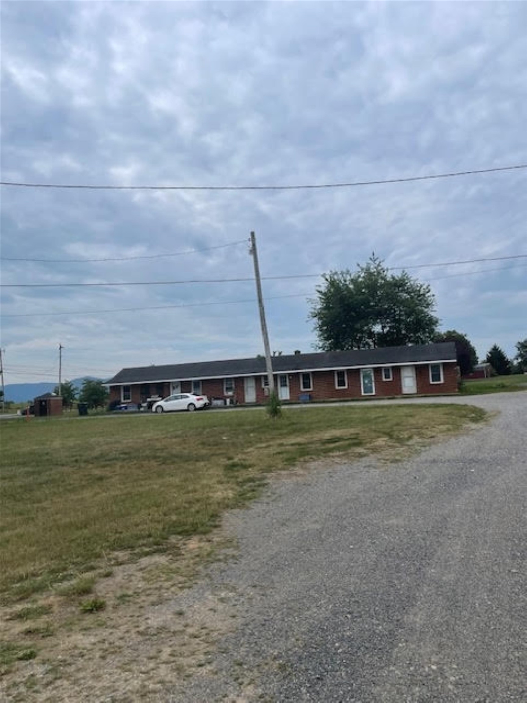 a view of a big yard with a house