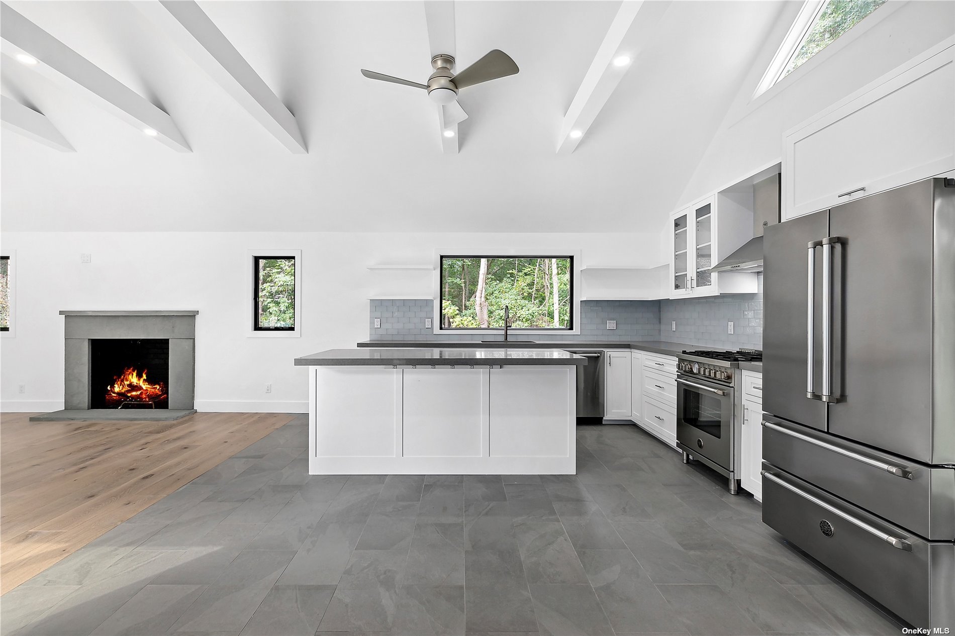 a kitchen with stainless steel appliances a stove sink and refrigerator