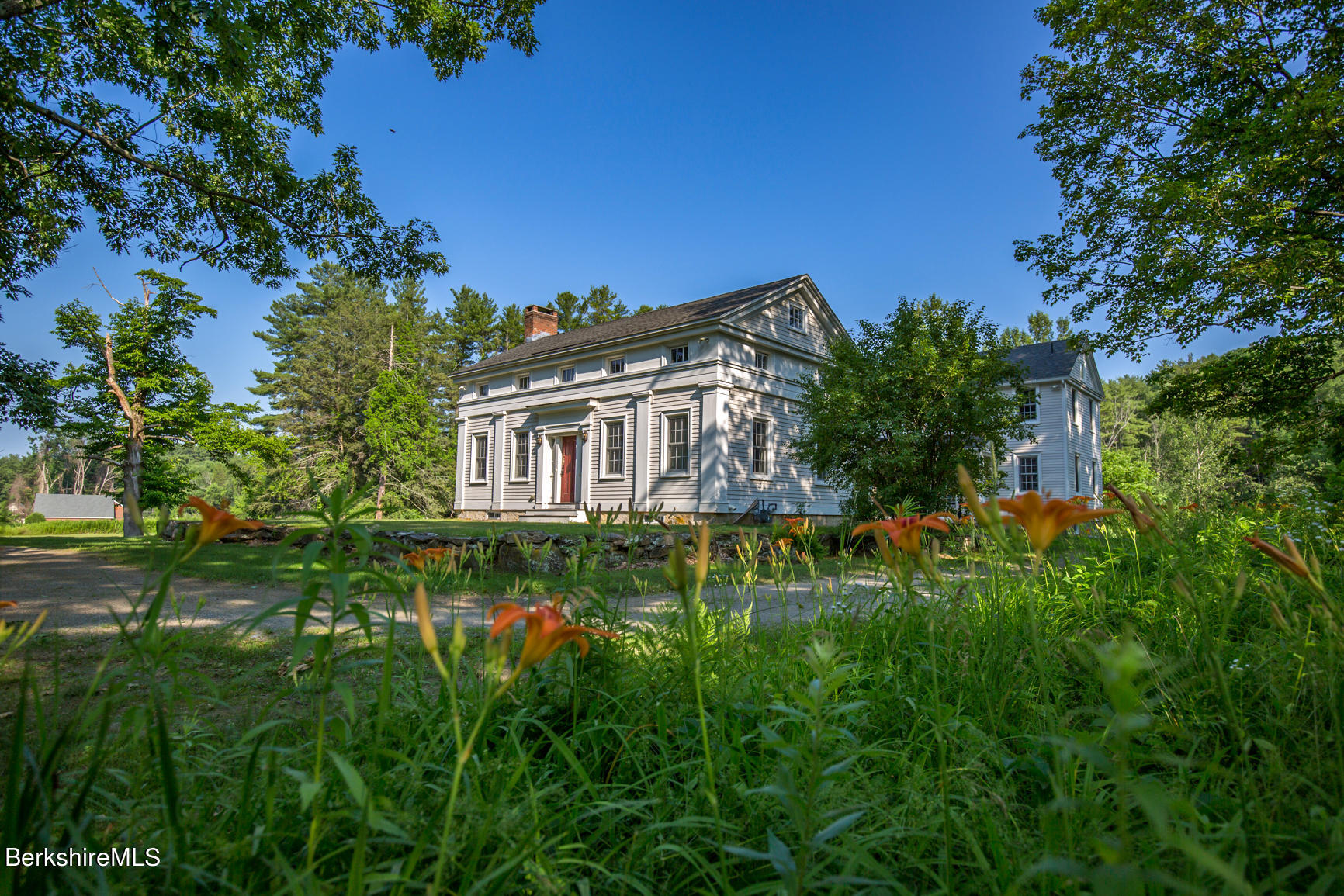 a view of a house with a big yard