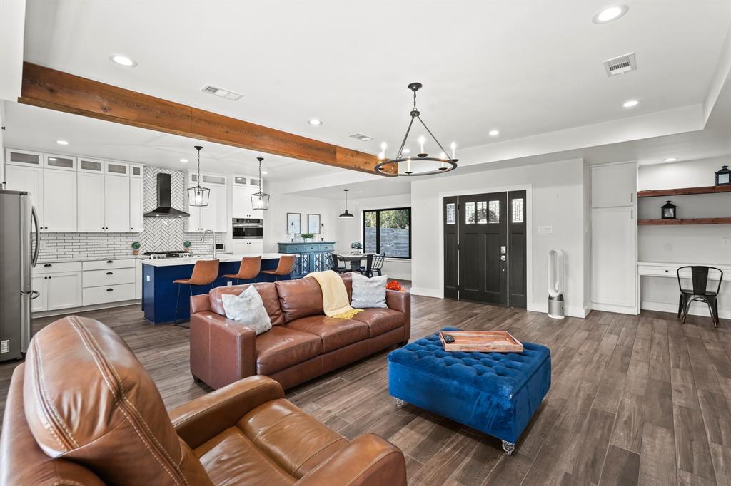 a living room with furniture and kitchen view