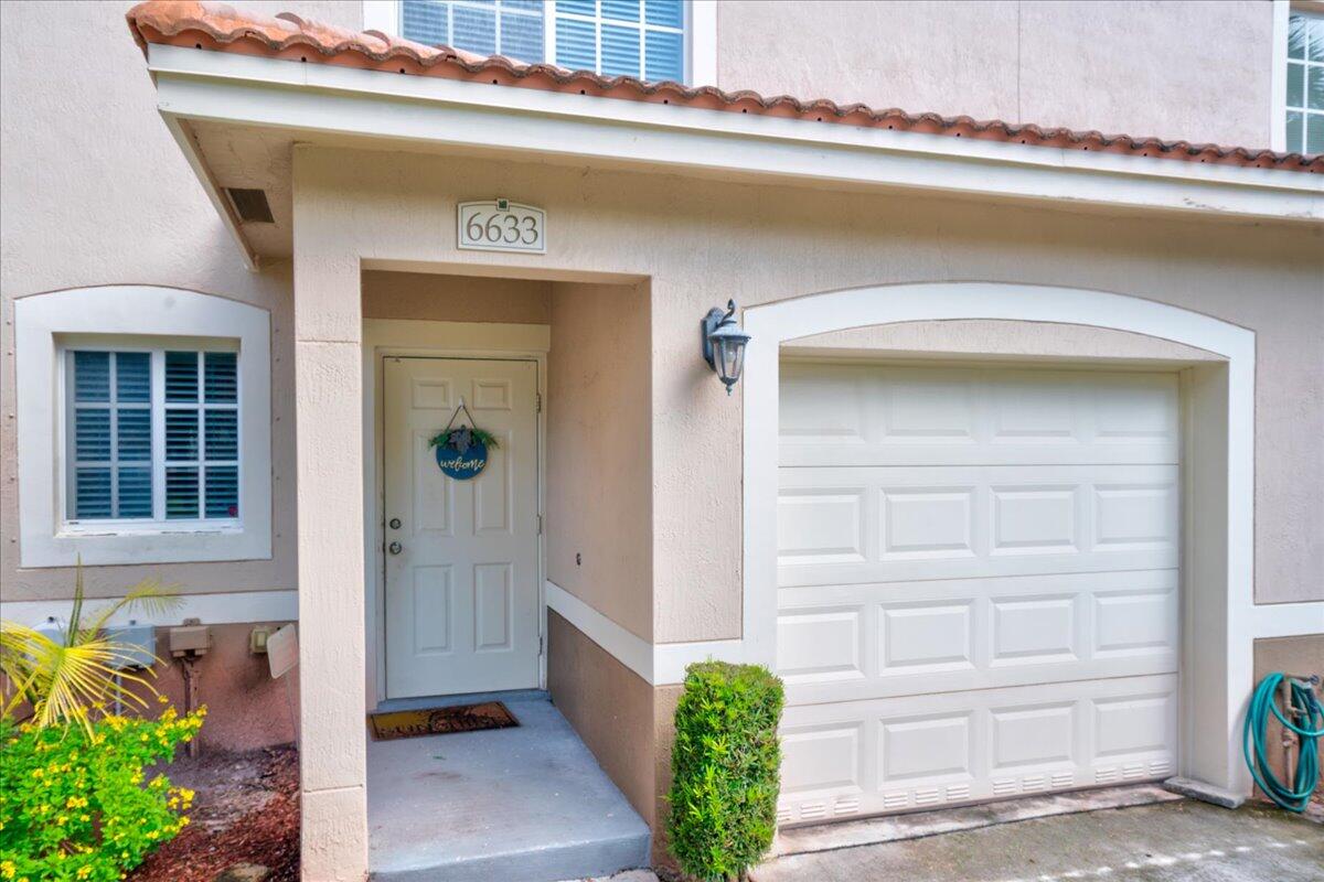 a front view of a house with a garage