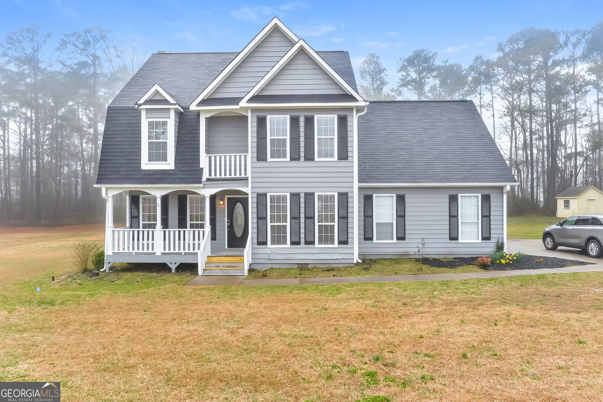 a front view of a house with a yard