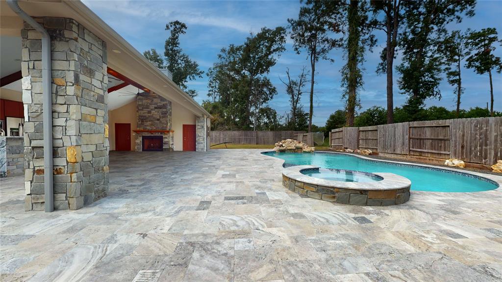 a view of a swimming pool with a back yard