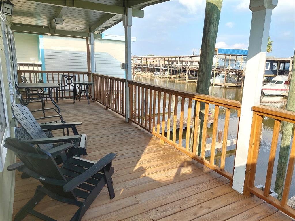 a view of a balcony with wooden floor