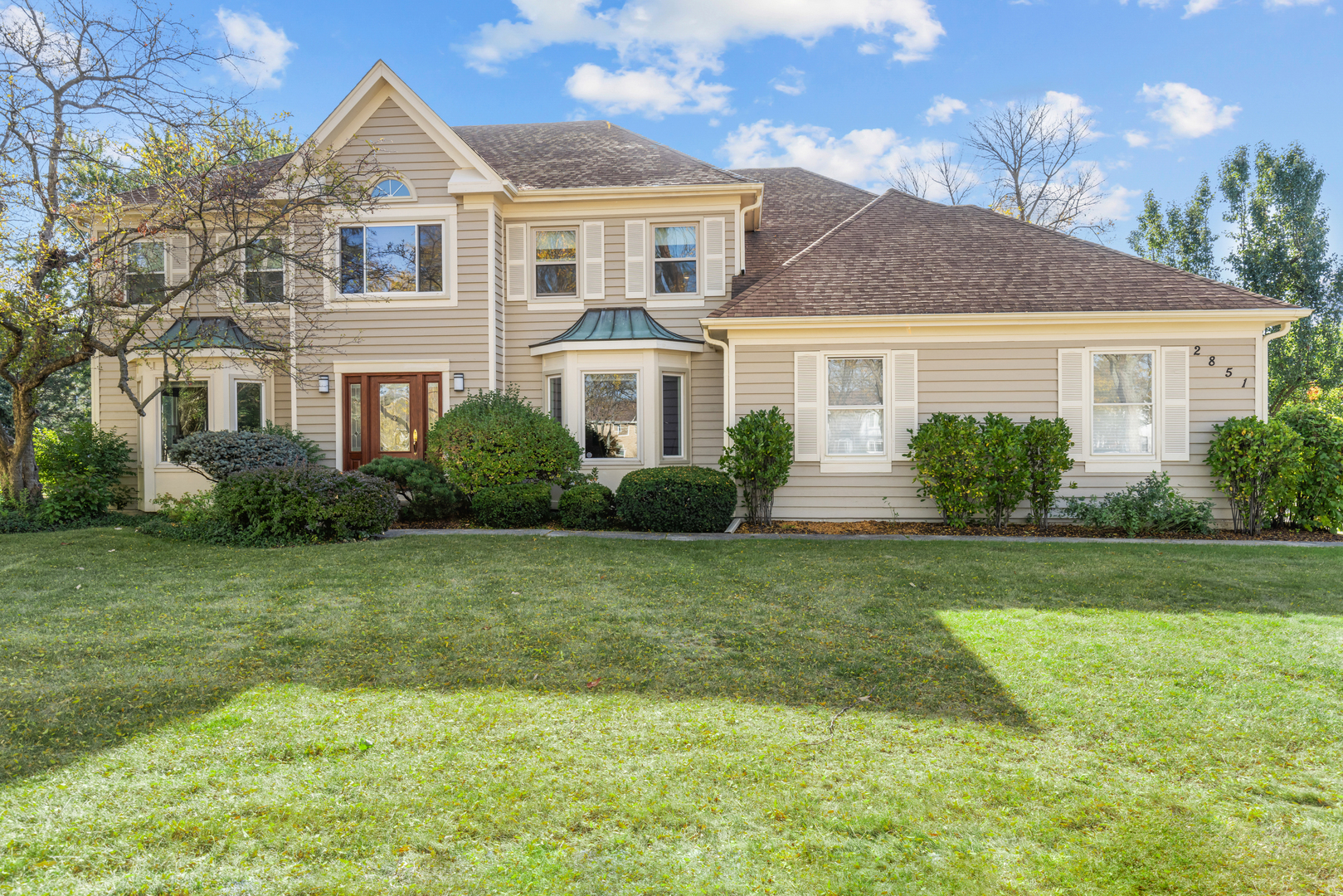 a front view of a house with a yard