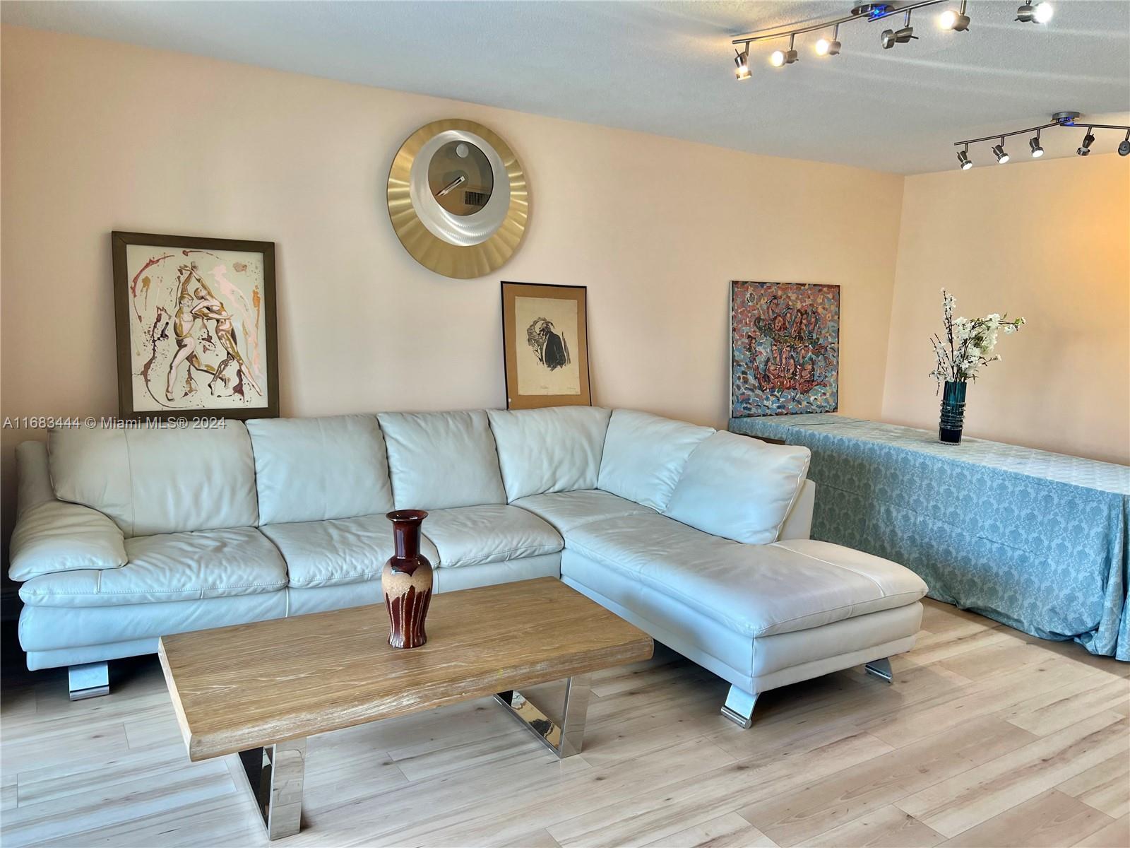 a living room with furniture and a table