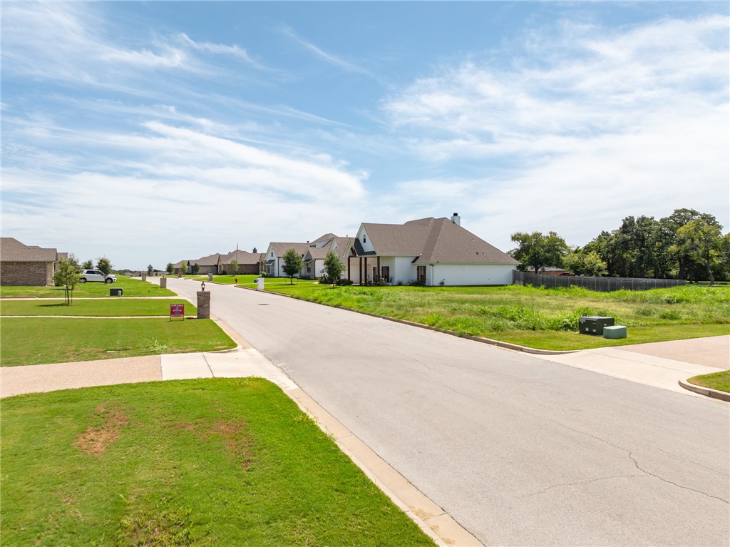 a view of a swimming pool and a yard