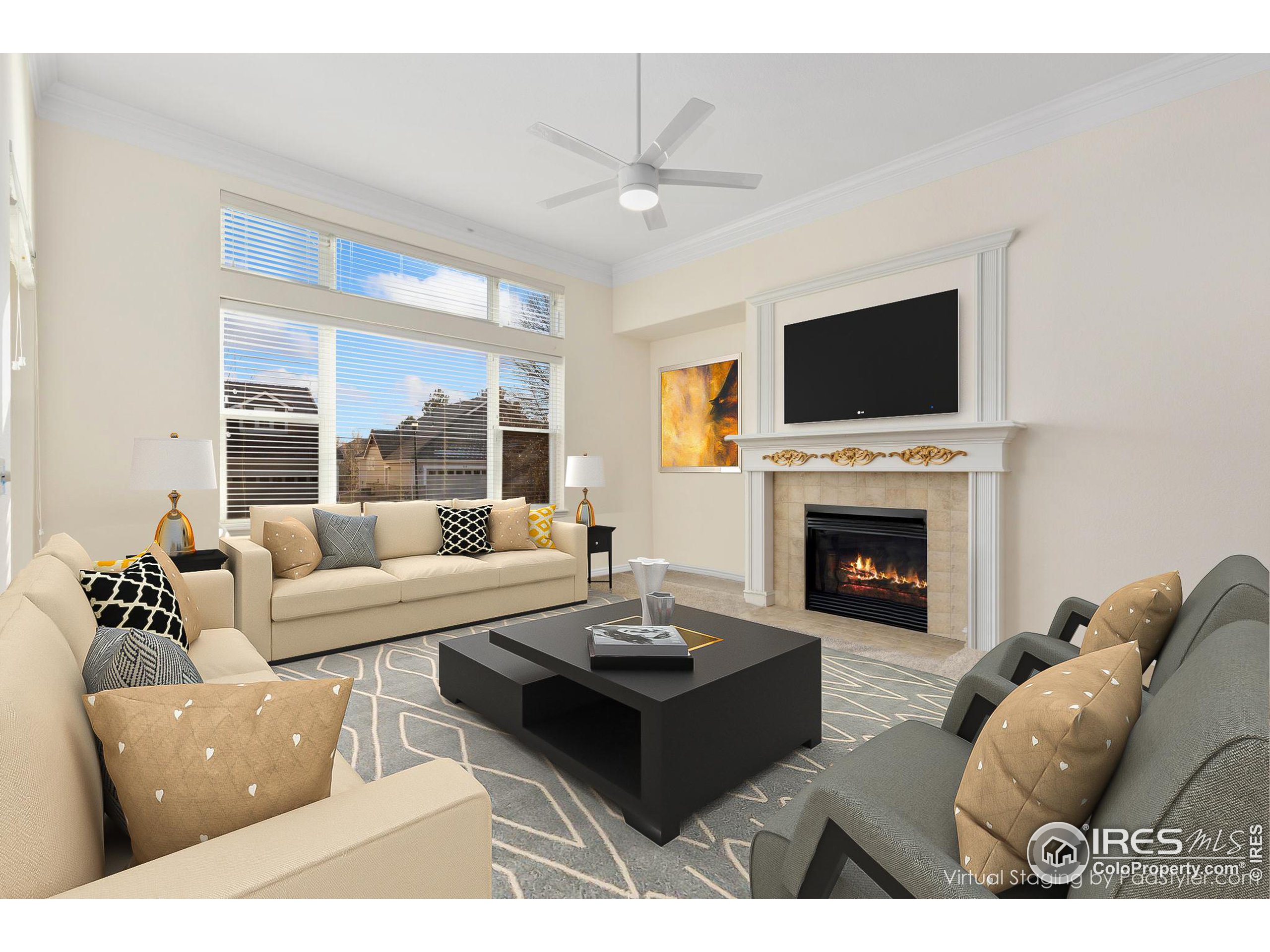 a living room with furniture a fireplace and a flat screen tv