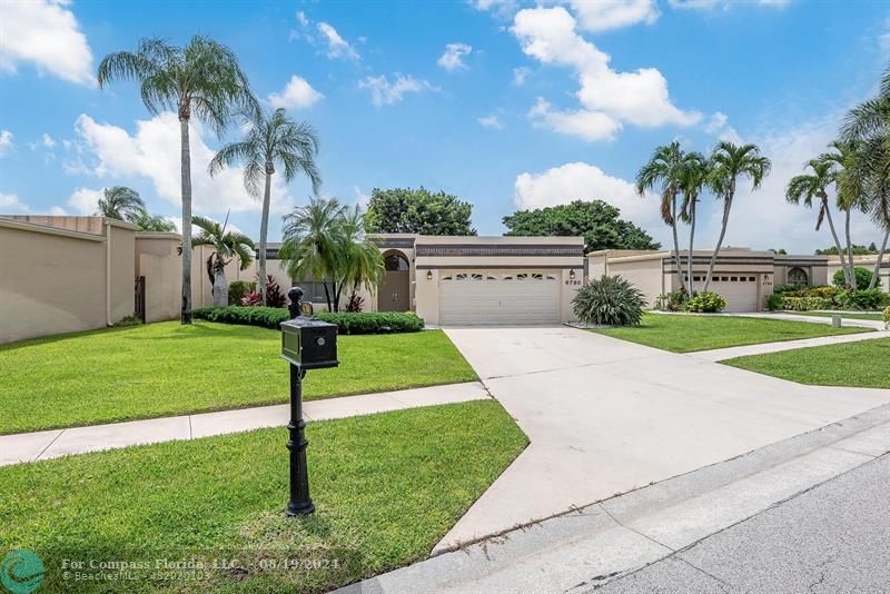 a view of a backyard with palm tree