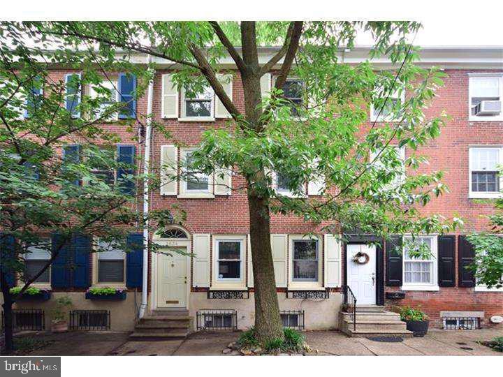 front view of house with a tree