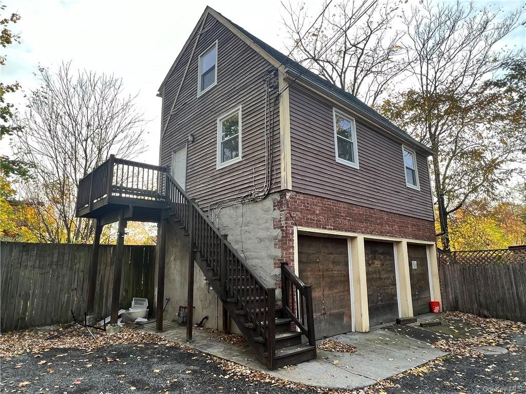 a front view of a house with garage