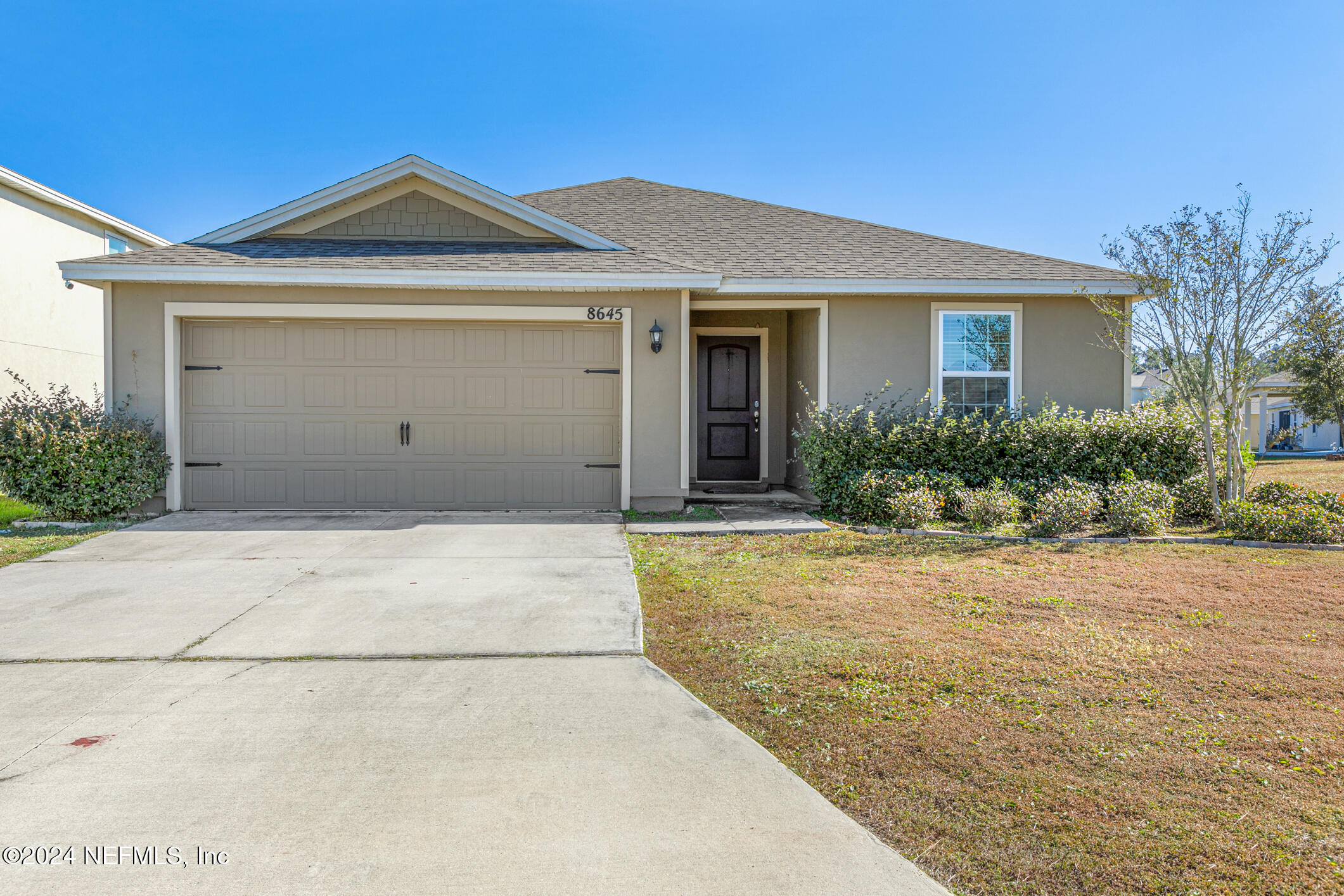 front view of a house with a yard