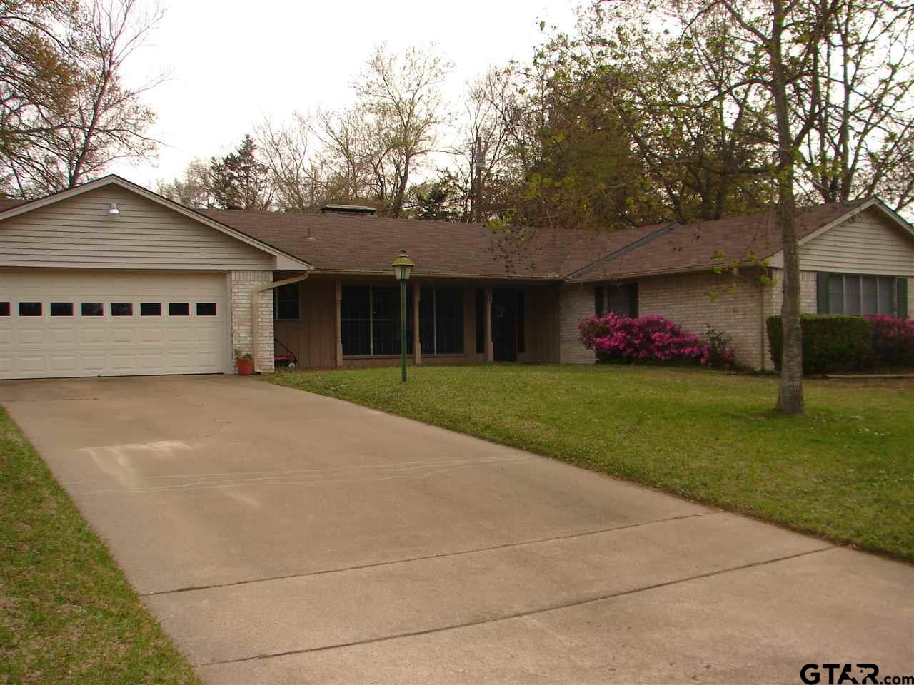 a house with garden in front of it