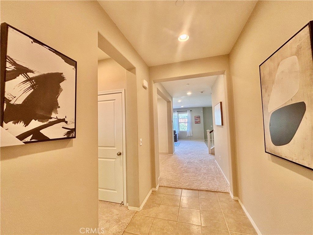 a view of a bathroom from a hallway