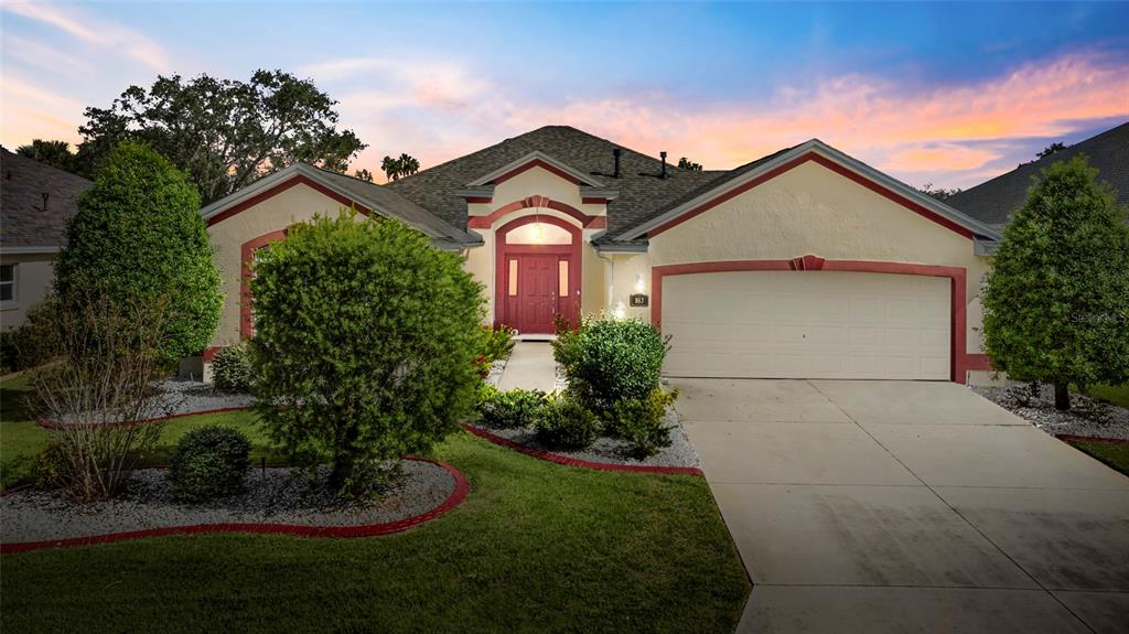 Welcome to this designer extended Lantana home nestled between 466 and 466a in The Villages, FL