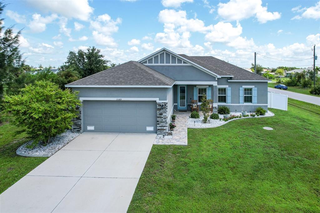 a front view of house with yard and green space