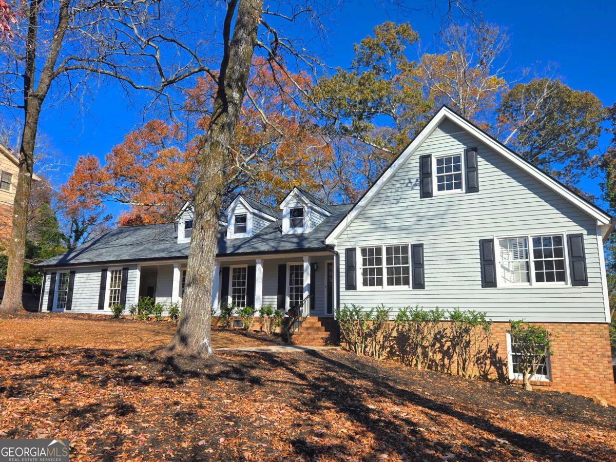 a house with trees in the background