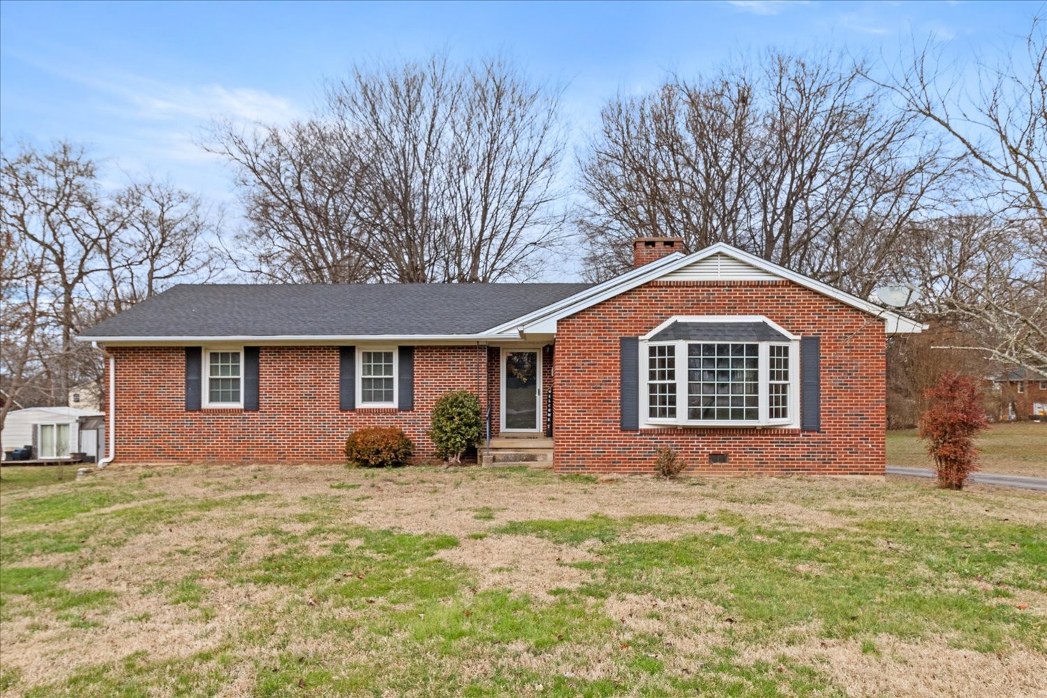 a front view of a house with yard