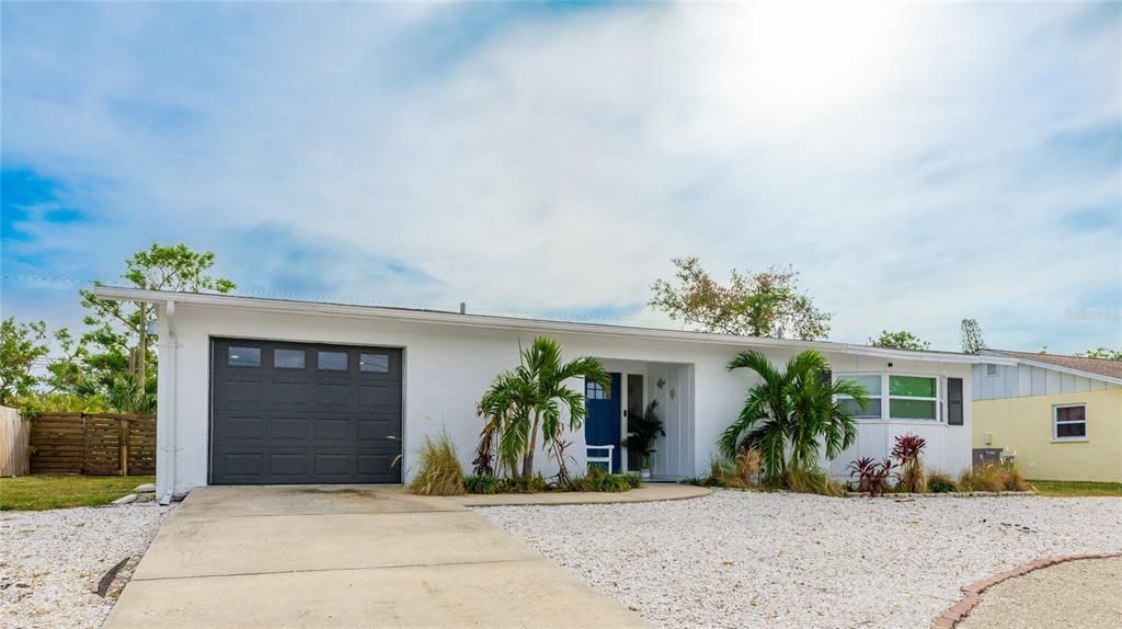 a front view of a house with a garage