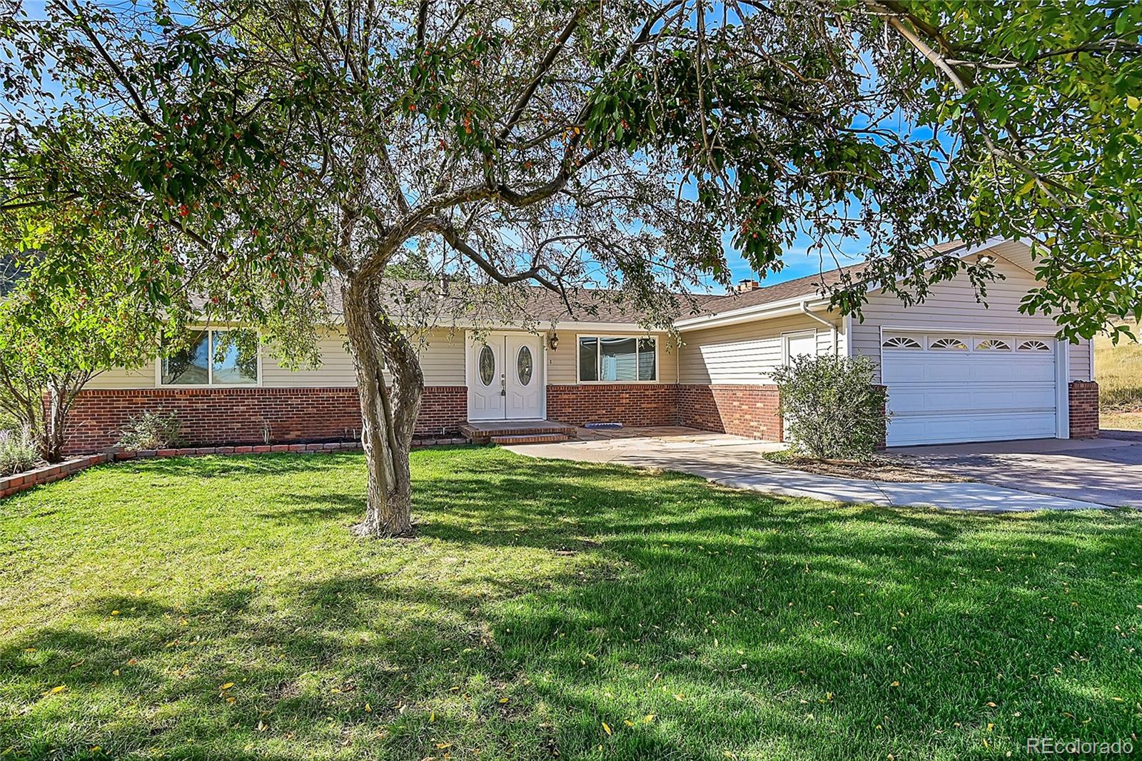 front view of a house with a yard