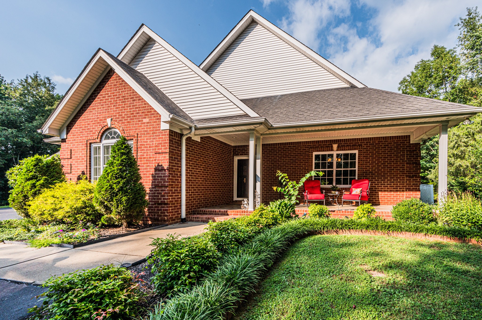 a front view of a house with an outdoor seating