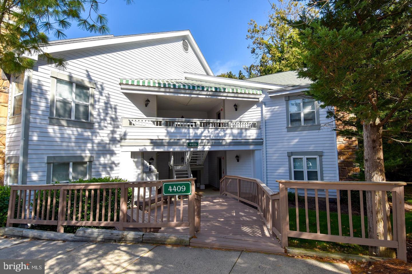 a front view of a house with a swing