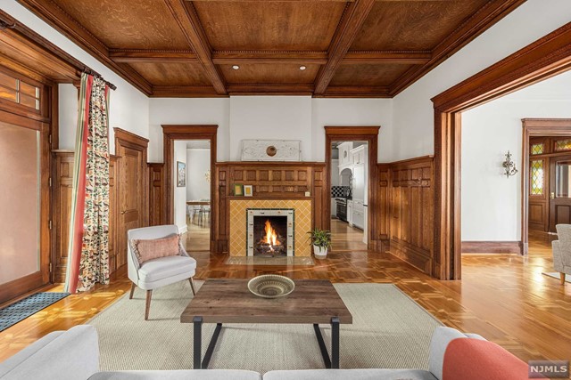 a living room with furniture a fireplace and a table