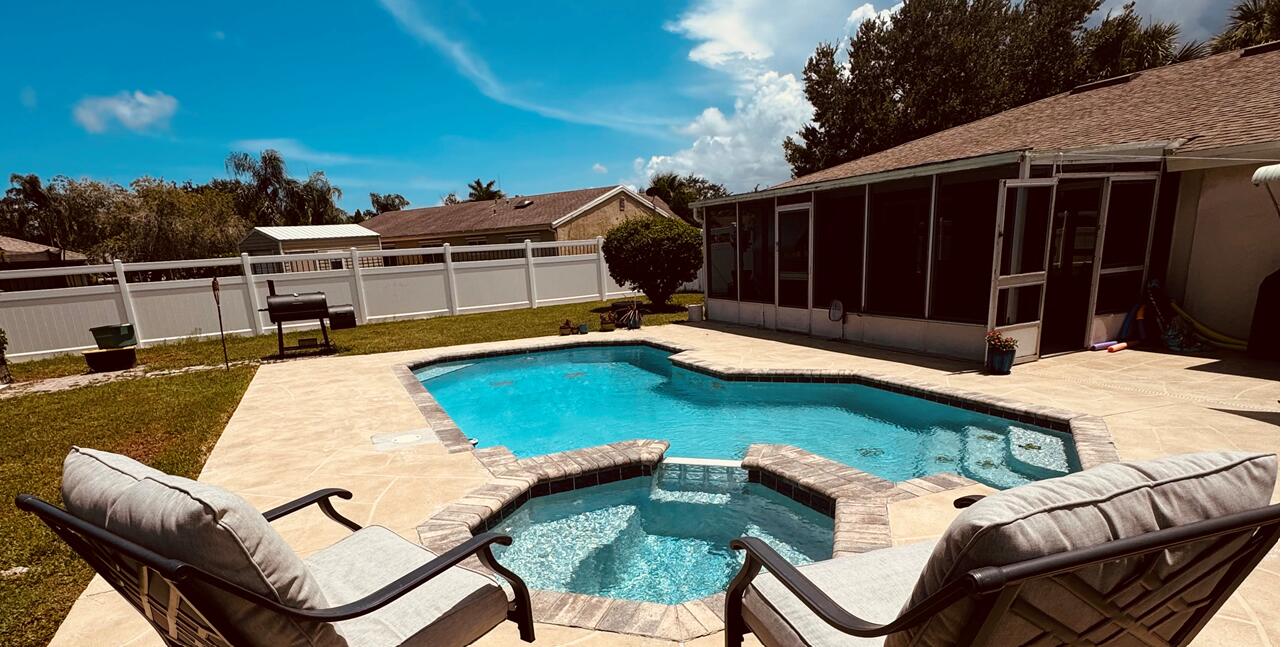 a view of a patio with swimming pool