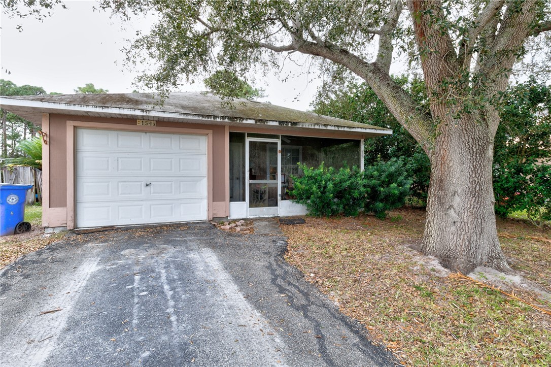 a view of a house with a tree