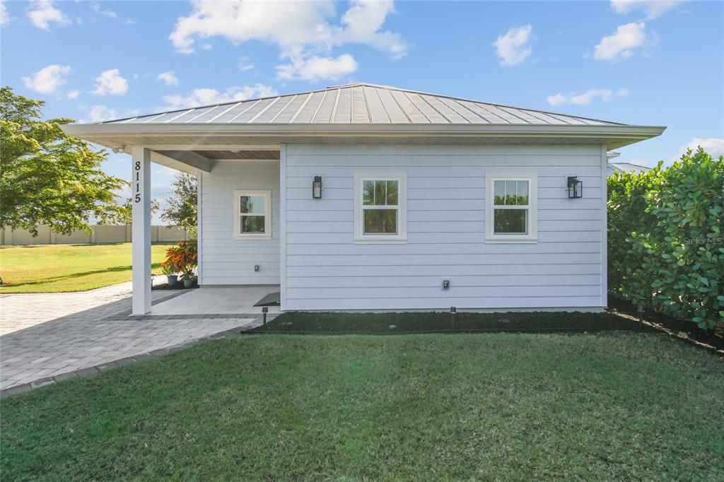 a view of a house with a backyard